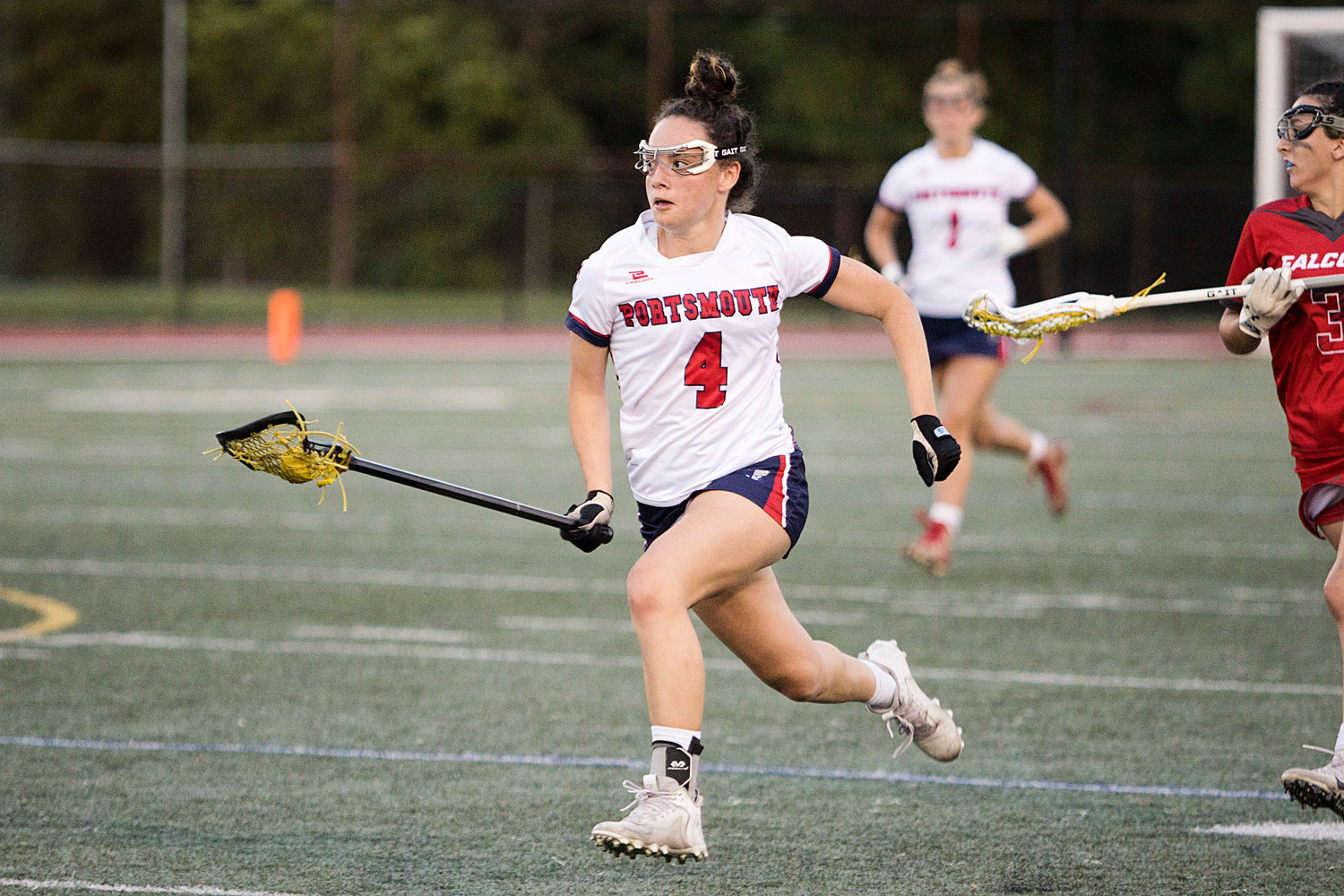 Ellie Skeels makes a break for the net late in the second half of the Division II semifinals, Tuesday. She scored the last six goals of the game — the decisive factor in the Patriots’ improbable comeback.