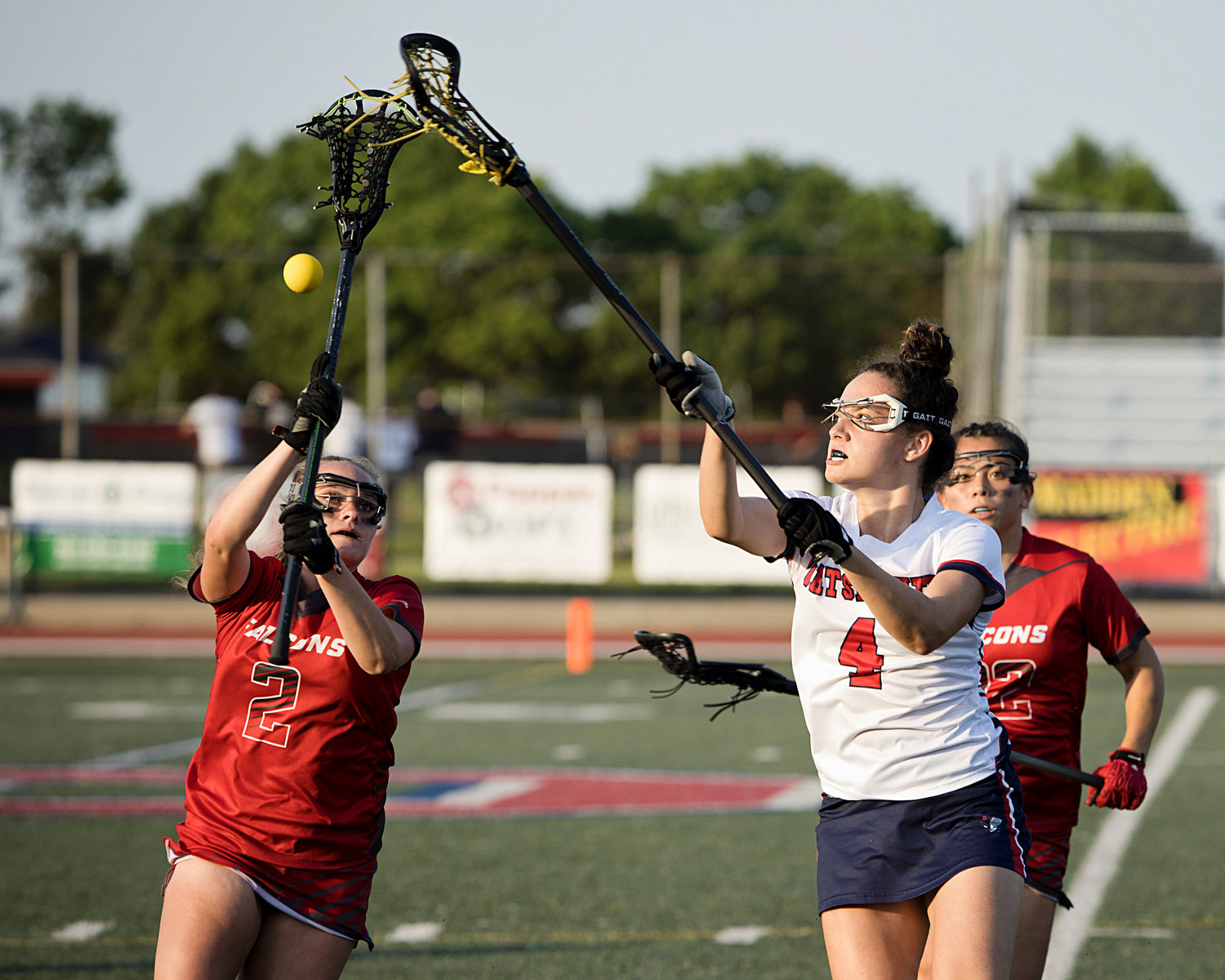 Ellie Skeels knocks the ball out of a Cranston West opponent's stick during the first half of the Division II semifinals.