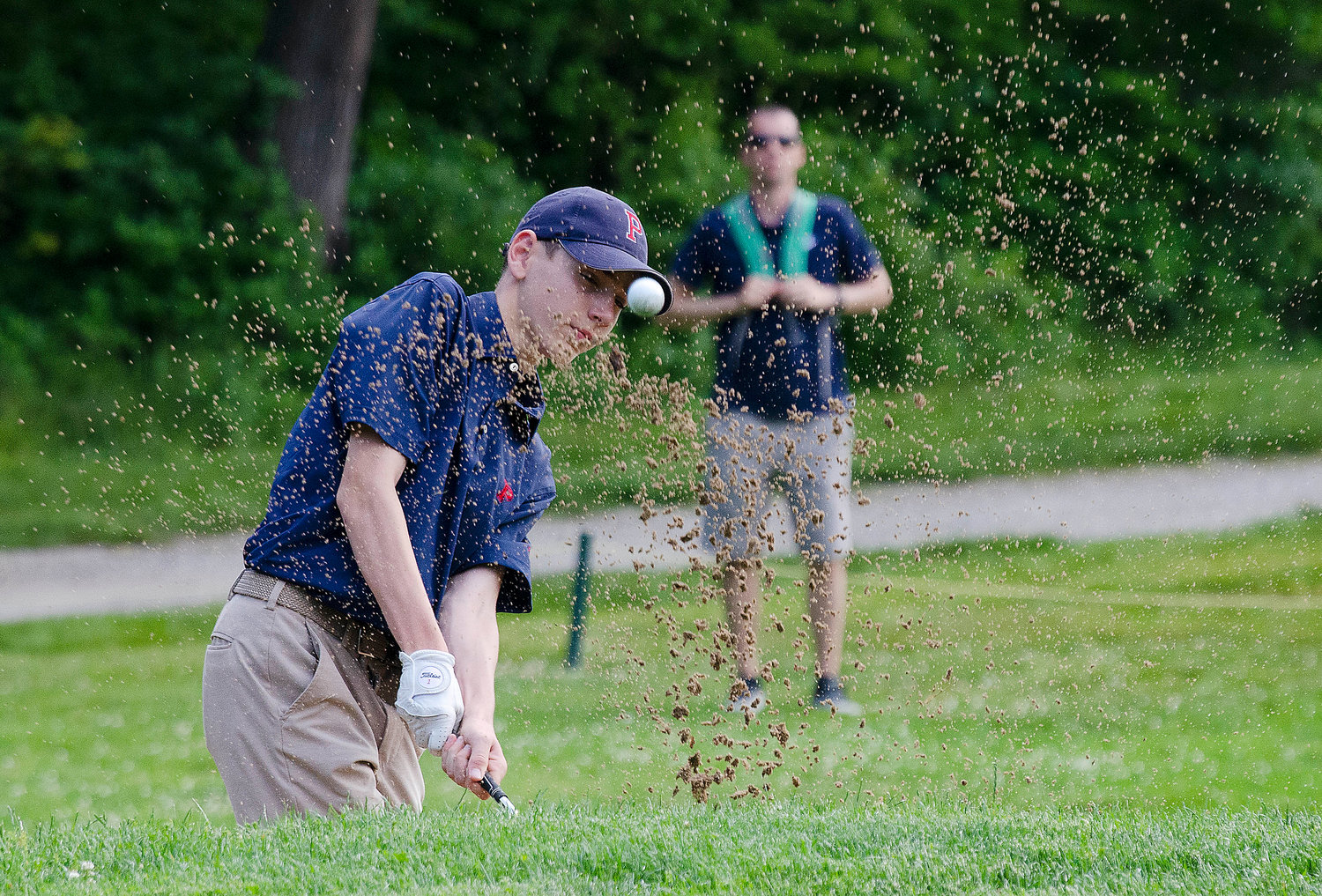 Kyle Bielawa, here chipping out of a sand trap, shot a 96 for Portsmouth.