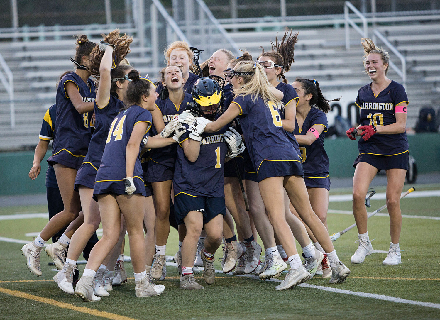 The Eagles swarm around goalie Audrey Keefe after beating Moses Brown, 10-8, in the Division 1 girls lacrosse finals on Saturday.