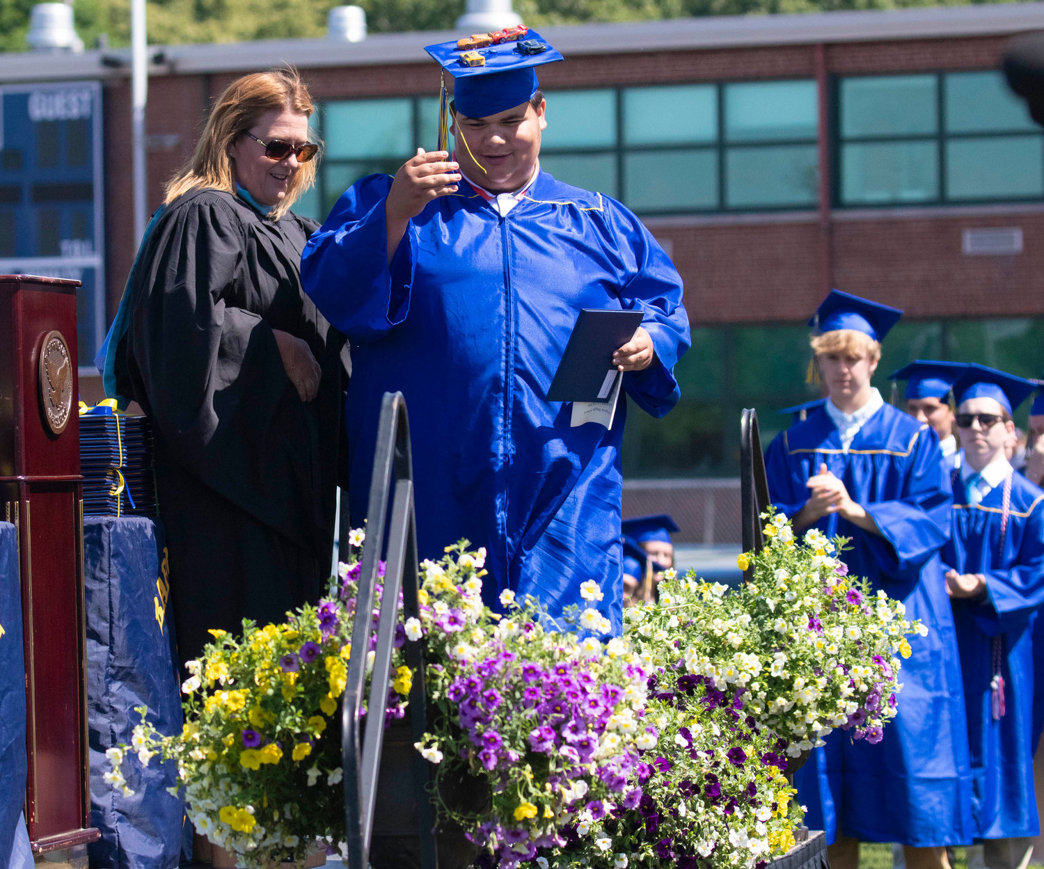 MichaelAngelo Barretto crosses the stage after receiving his diploma during the graduation ceremony at Victory Field on Sunday, June 5.