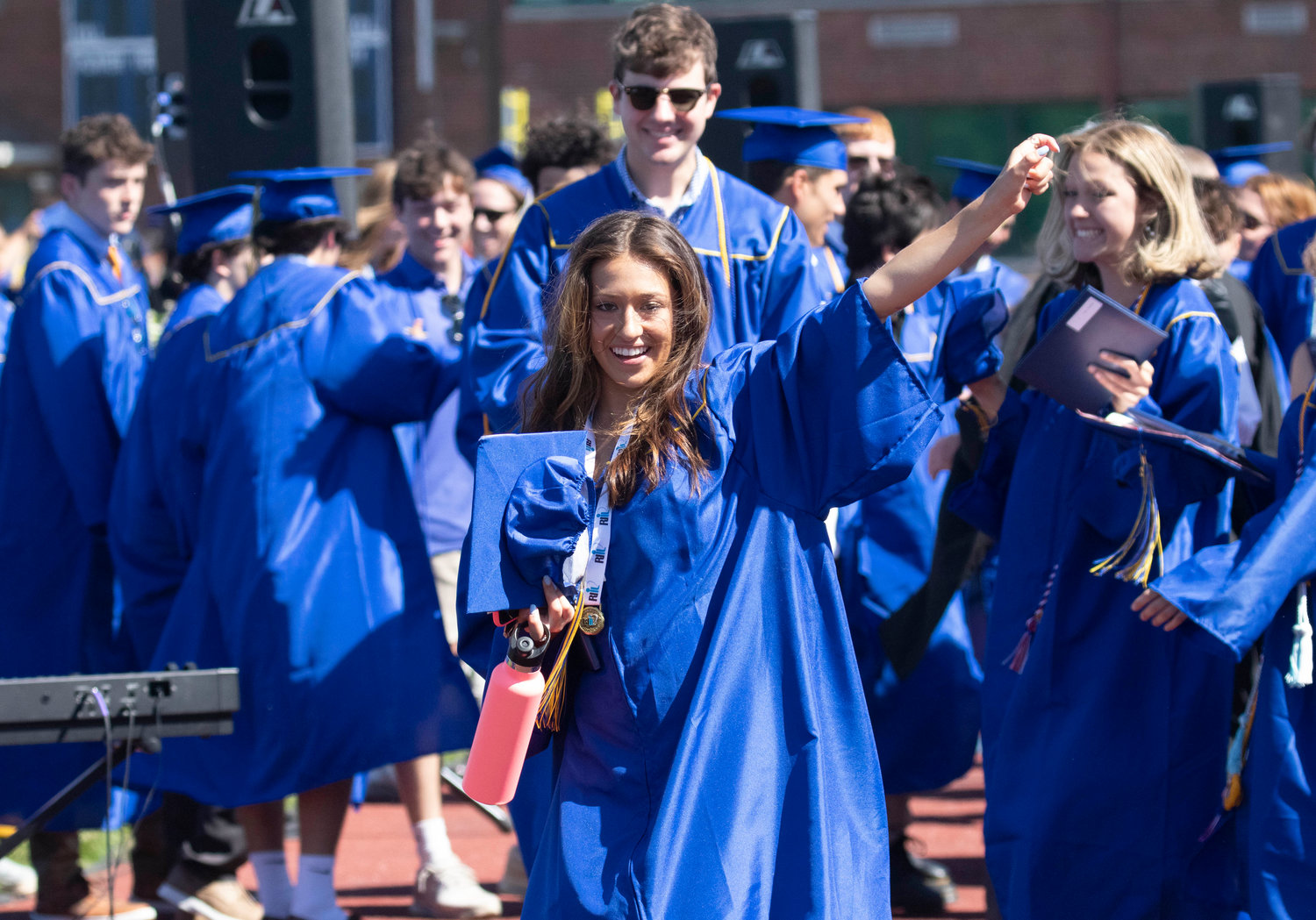 A final wave following the graduation ceremony on Sunday.