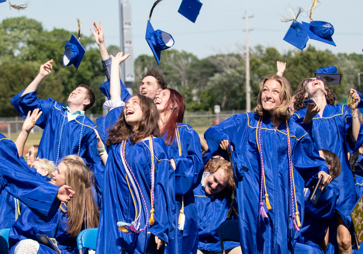 Caps fly into the air following Sunday’s graduation ceremony at Barrington High School.