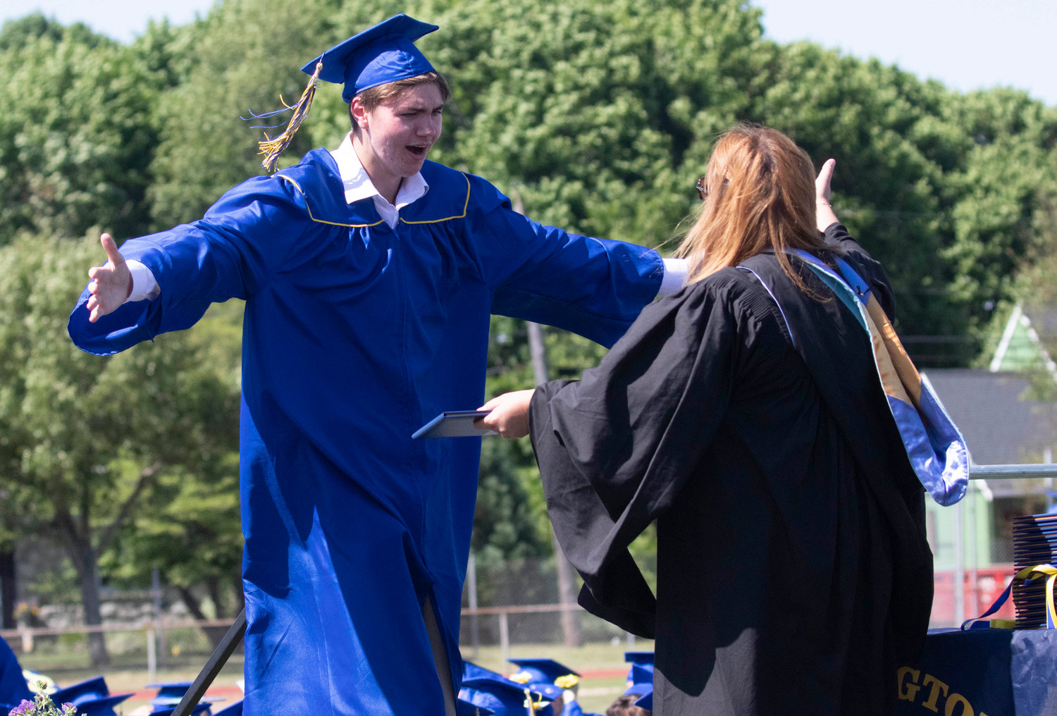 Eli Short receives his diploma during Sunday’s graduation ceremony.