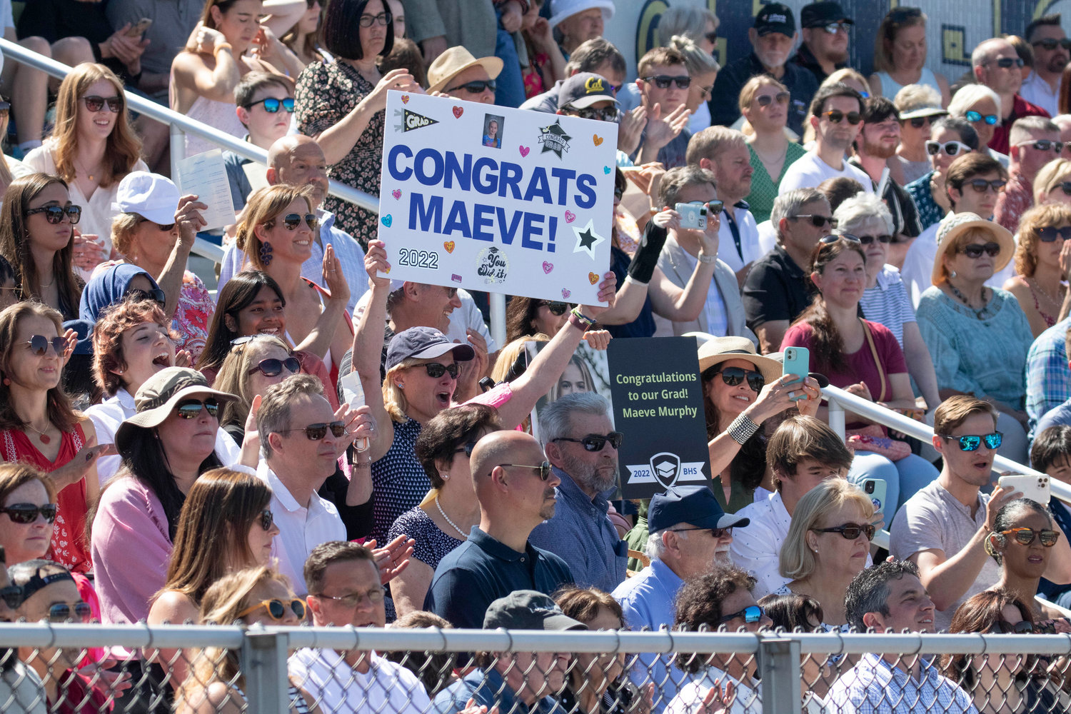 Family and friends cheer for Maeve Murphy during the graduation ceremony at Victory Field on Sunday, June 5.