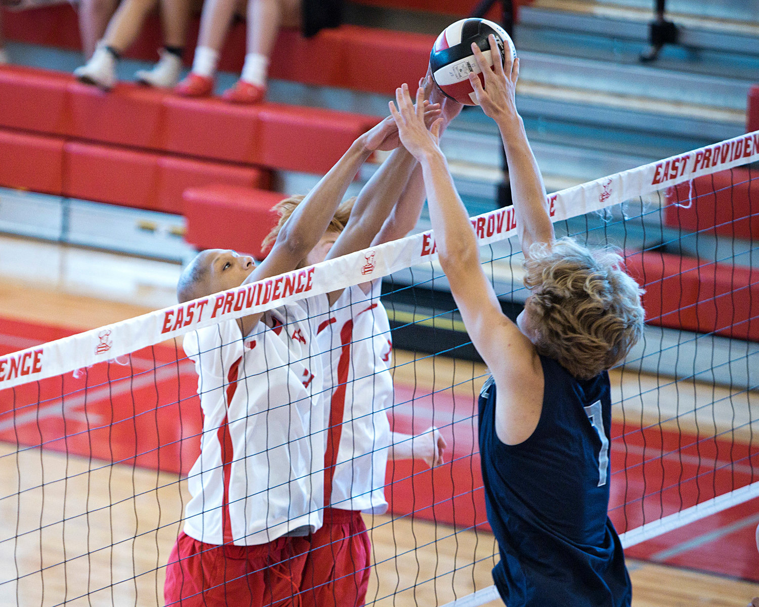 East Providence High School’s Jason Cadwell and Kyle Dunn block a Westerly shot from coming back over the net.