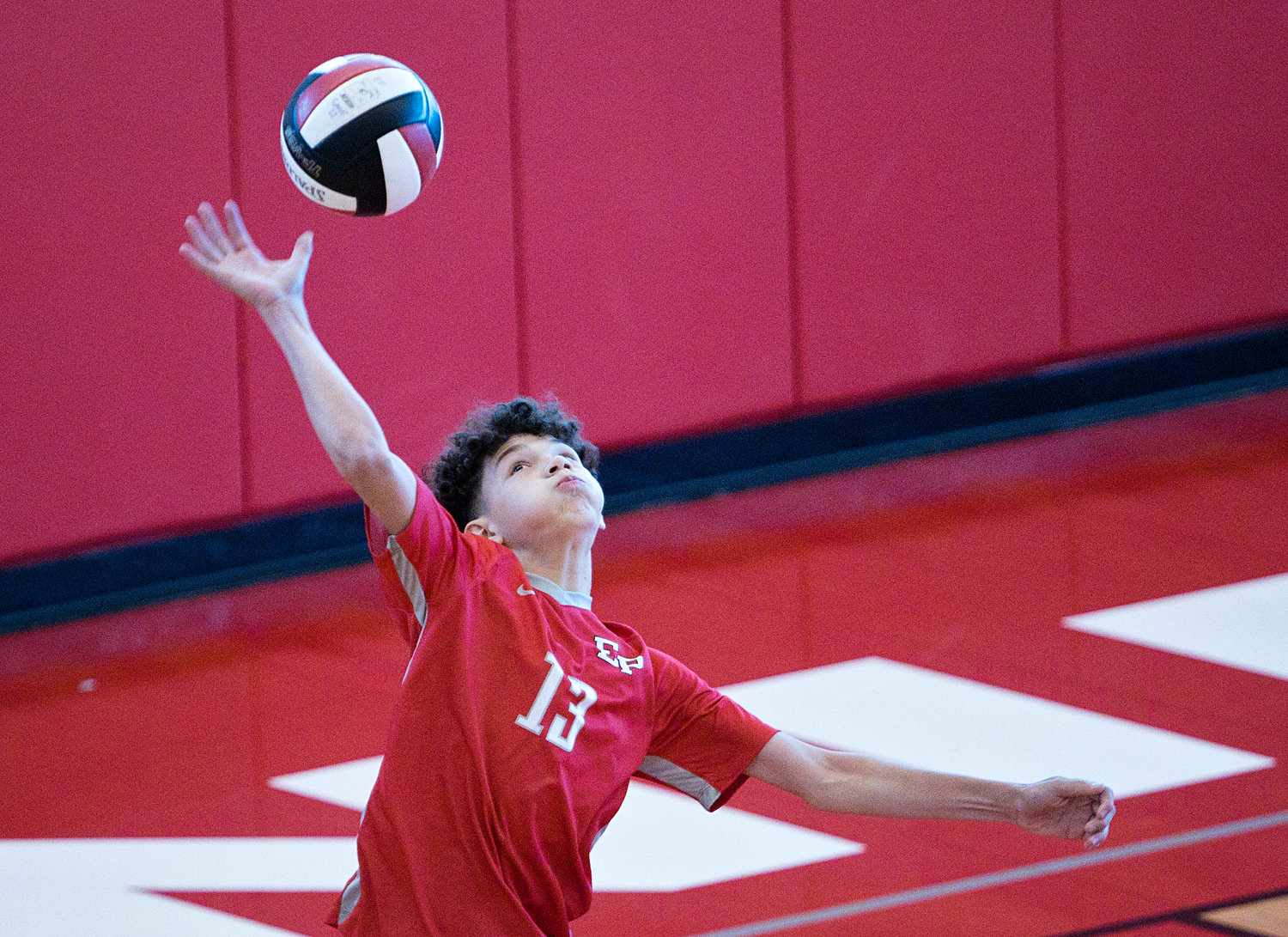 East Providence High School’s Jordan Rodrigues serves the ball to Westerly during the first set of the Division II boys' volleyball semifinals, Wednesday, June 8.