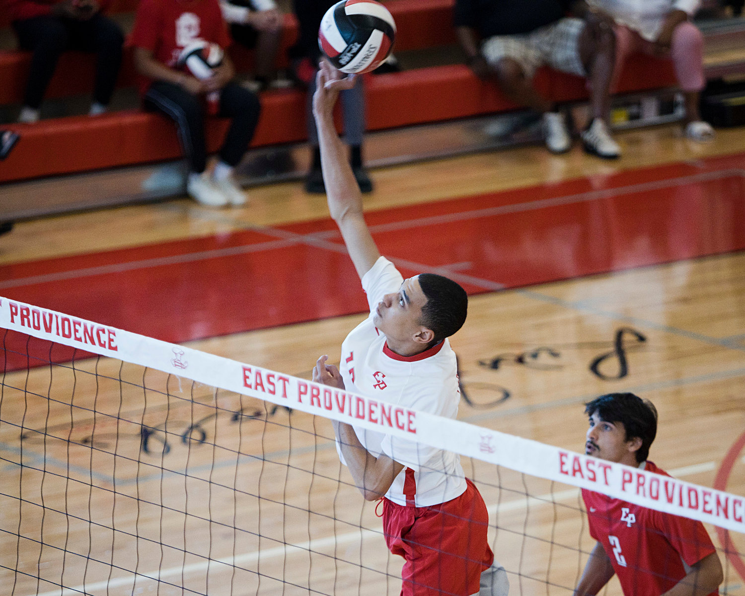 East Providence High School’s Grant Wosencroft tips the ball back over the net in the Division II boys' volleyball semifinals, Wednesday, June 8.