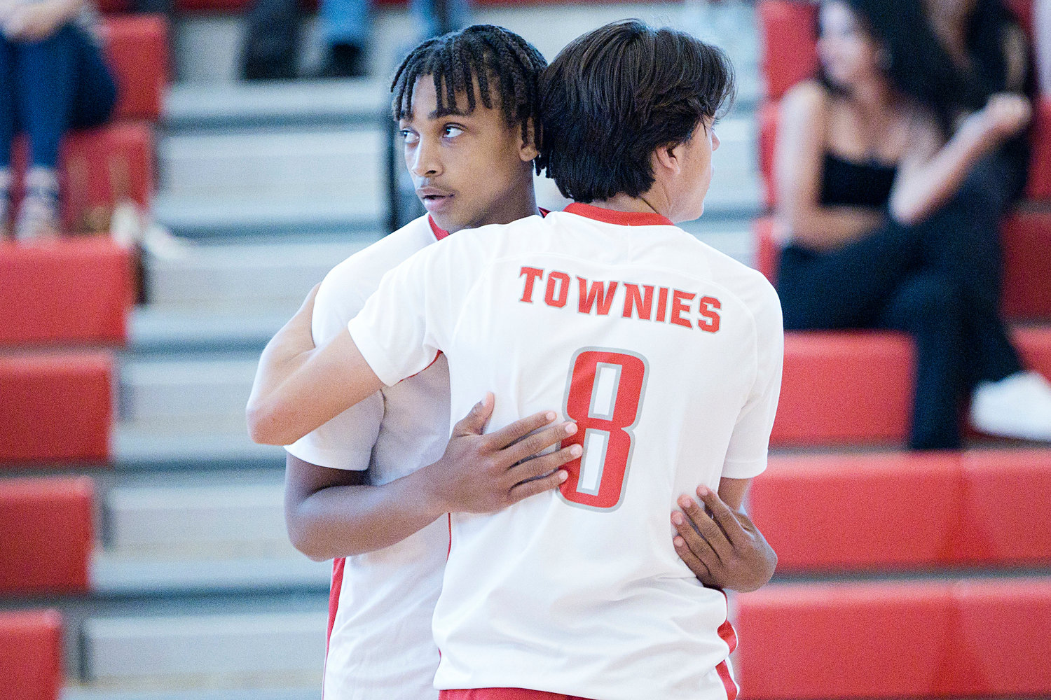 EPHS teammates Xavier Hazard and Brett Schwab exchange a hug after the Townies lost their Division II boys' volleyball semifinal match to Westerly, Wednesday, June 8.