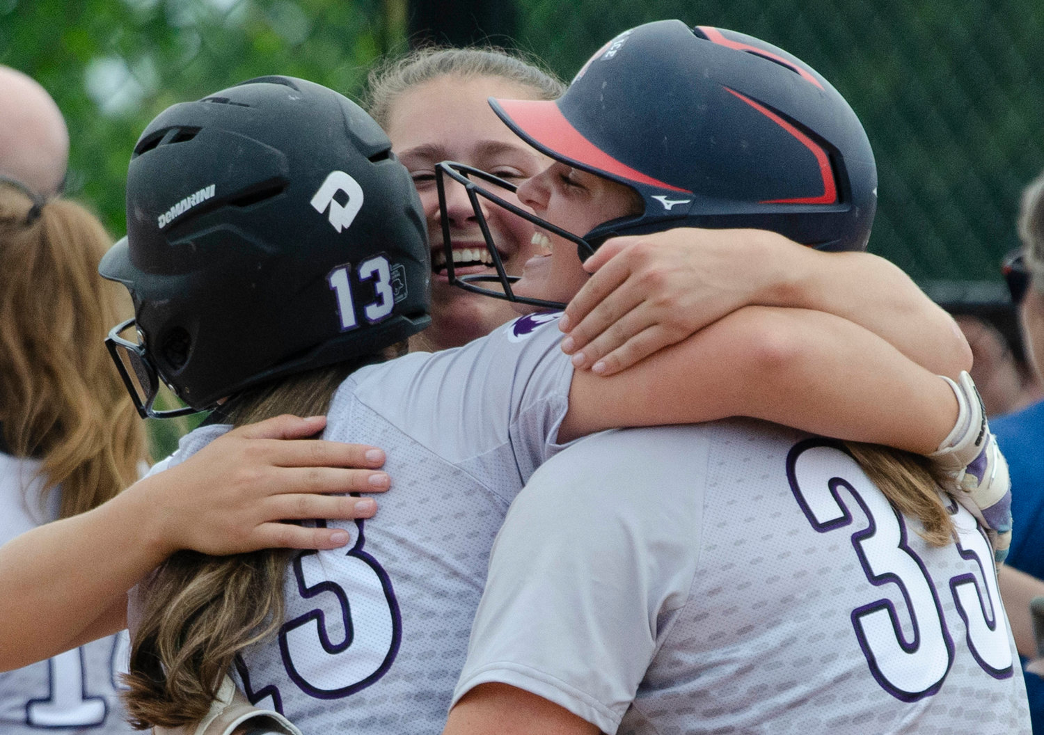 Seniors Levesque, Sylvia and Stephenson share a hug after the win.