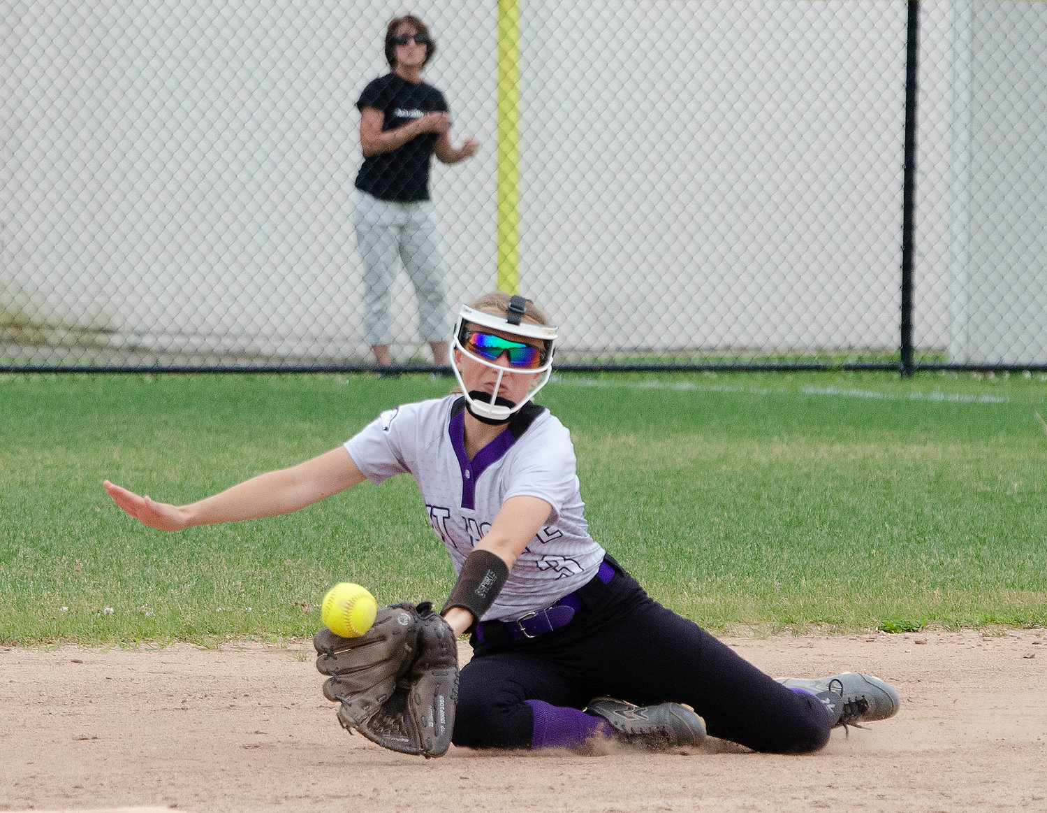 Second baseman Alice Grantham attempts to snare a grounder up the middle.