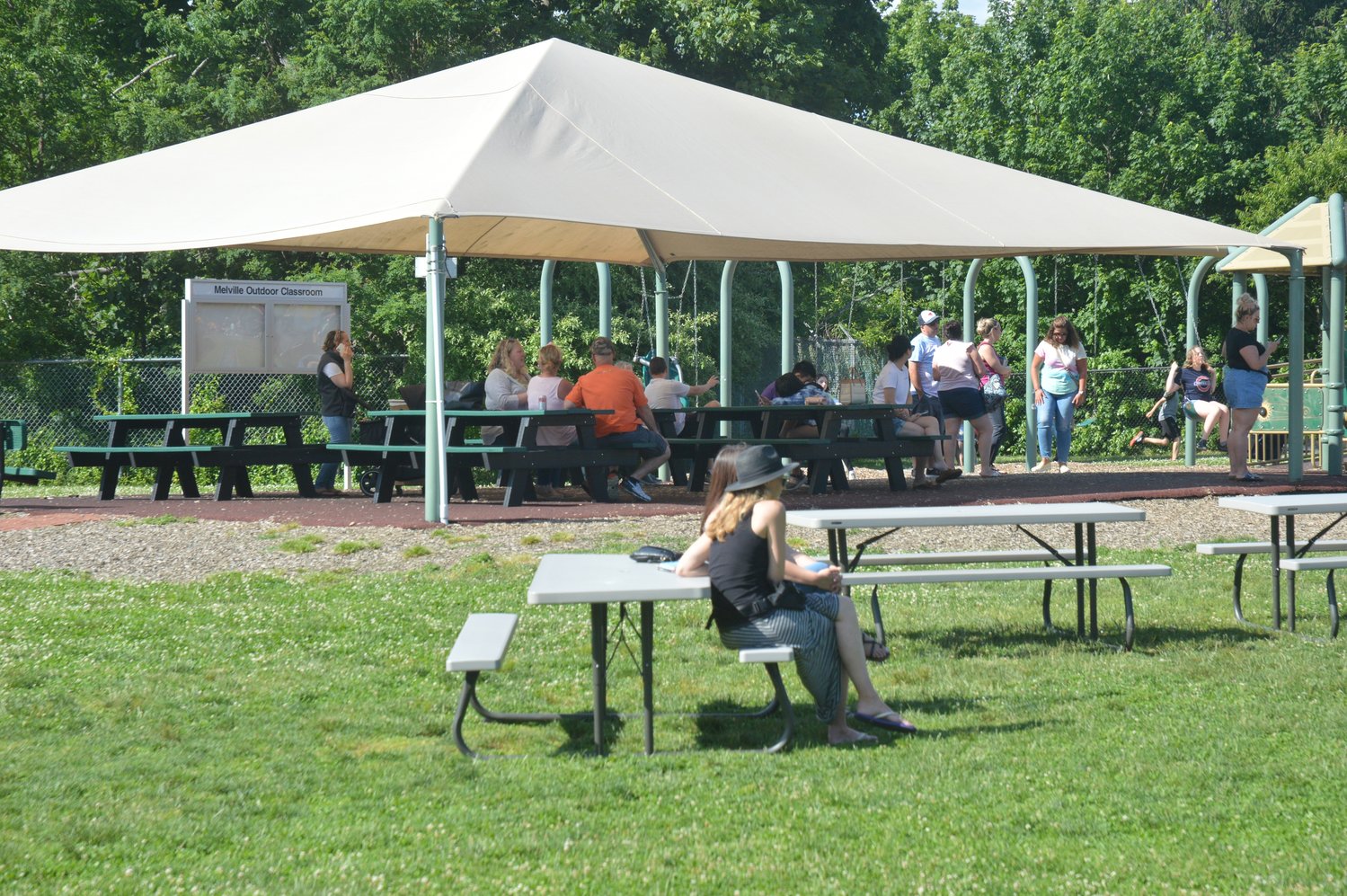 The Outdoor Learning Activity Zone at Melville School includes a separate tented area near the playground.