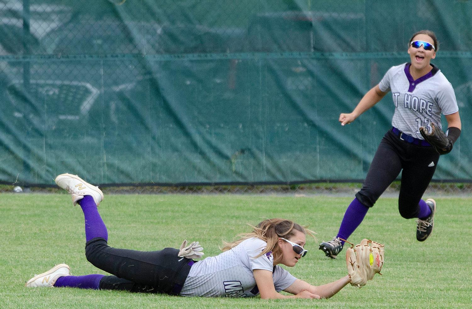 Logan Levesque looks on as Huskies centerfielder Jayda Sylvia makes a diving catch to steal a lead off hit from Prout three hitter Alivia Ring in the third inning.
