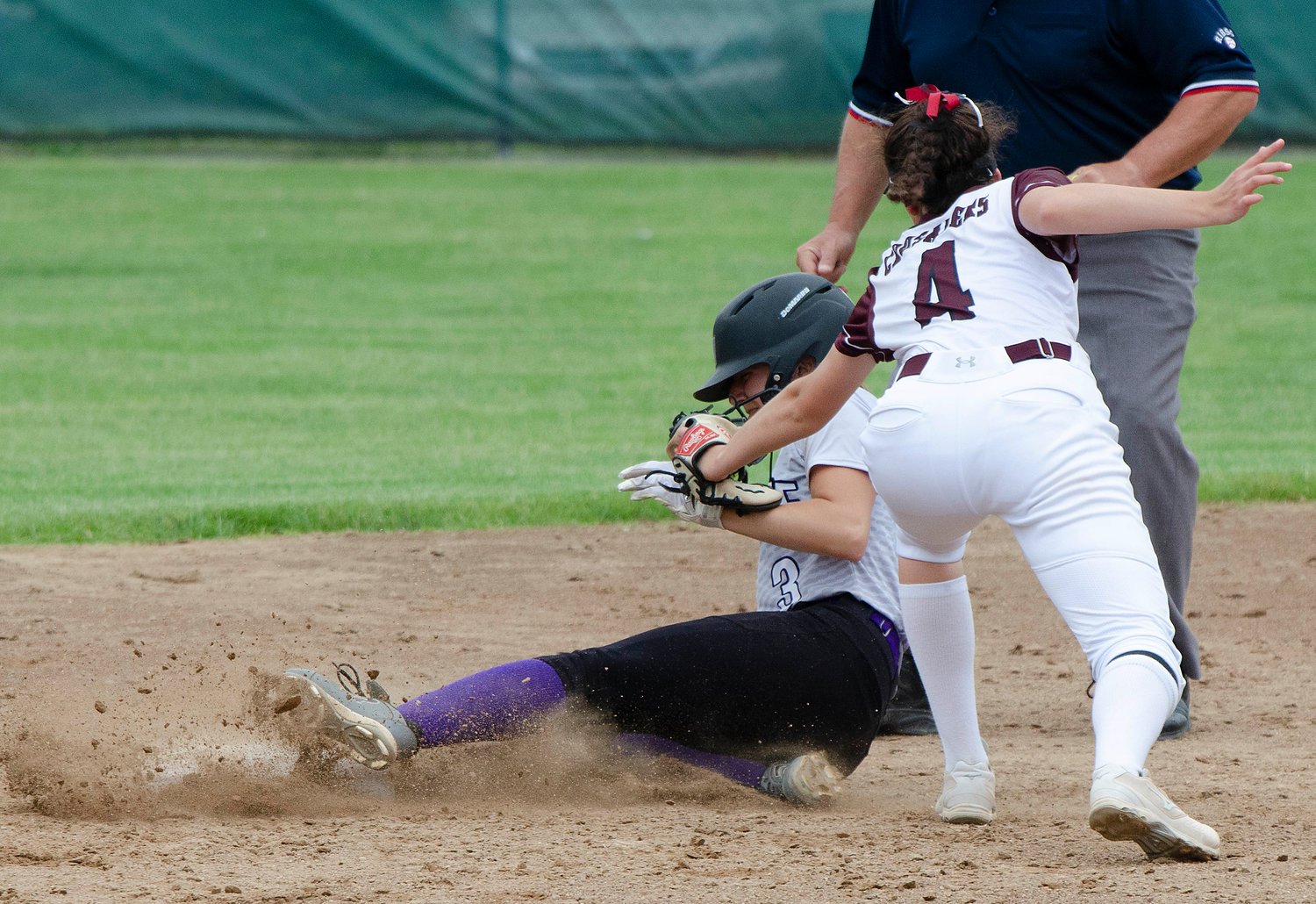 Alice Grantham steals second base in the top of the sixth inning to give the Huskies a runner on second base with two outs.