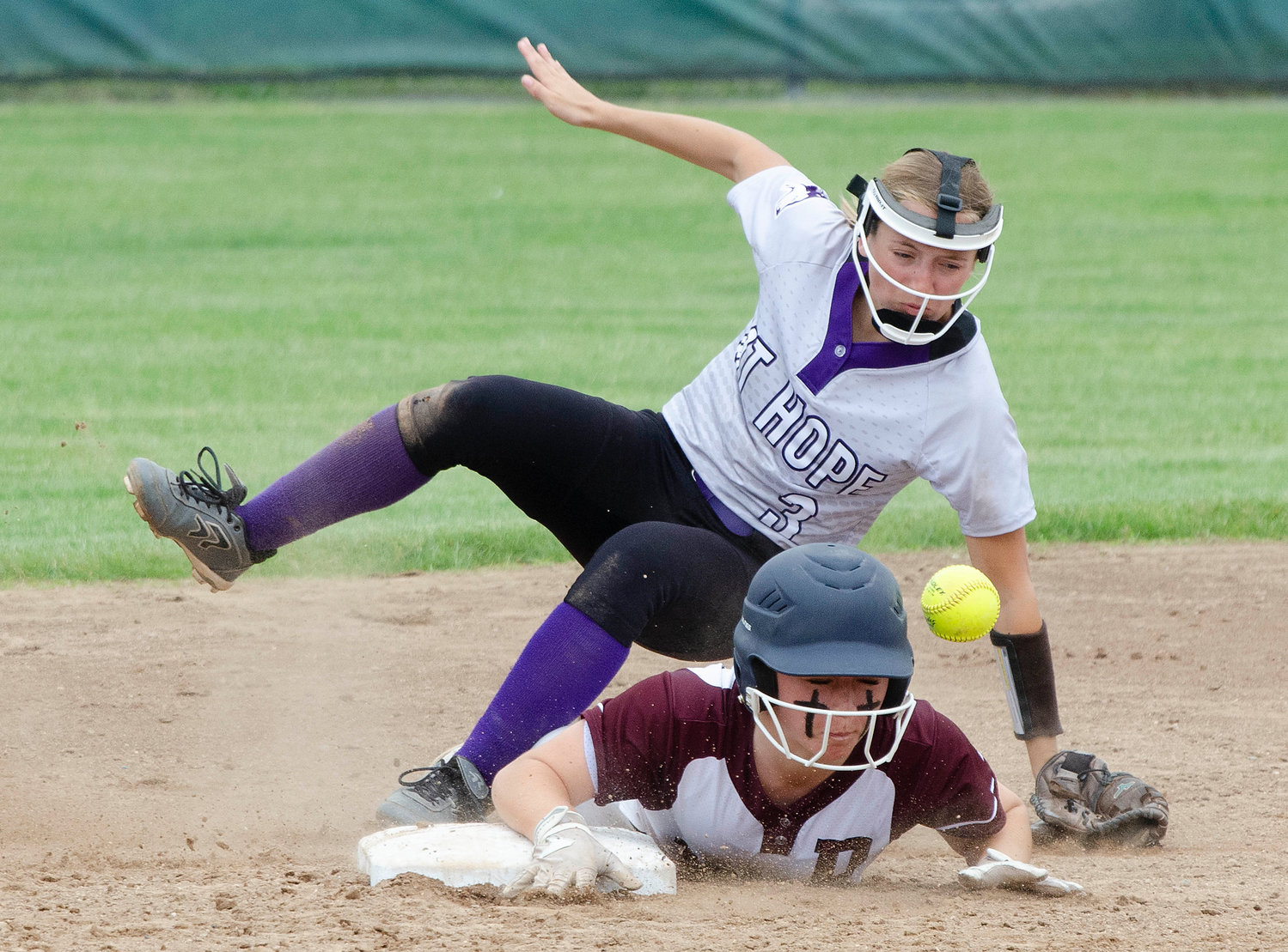 Prout’s Mead D’lorio up ends Huskies second baseman Alice Grantham as she slid into second base to lead off the inning. She later scored on a double by Alivia Ring to tie the game 1-1.