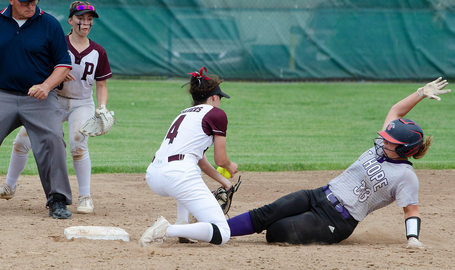Grace Stephenson steals second base in the hopes of an insurance run in the top of the tenth with the Huskies up 2-1, but she was stranded.