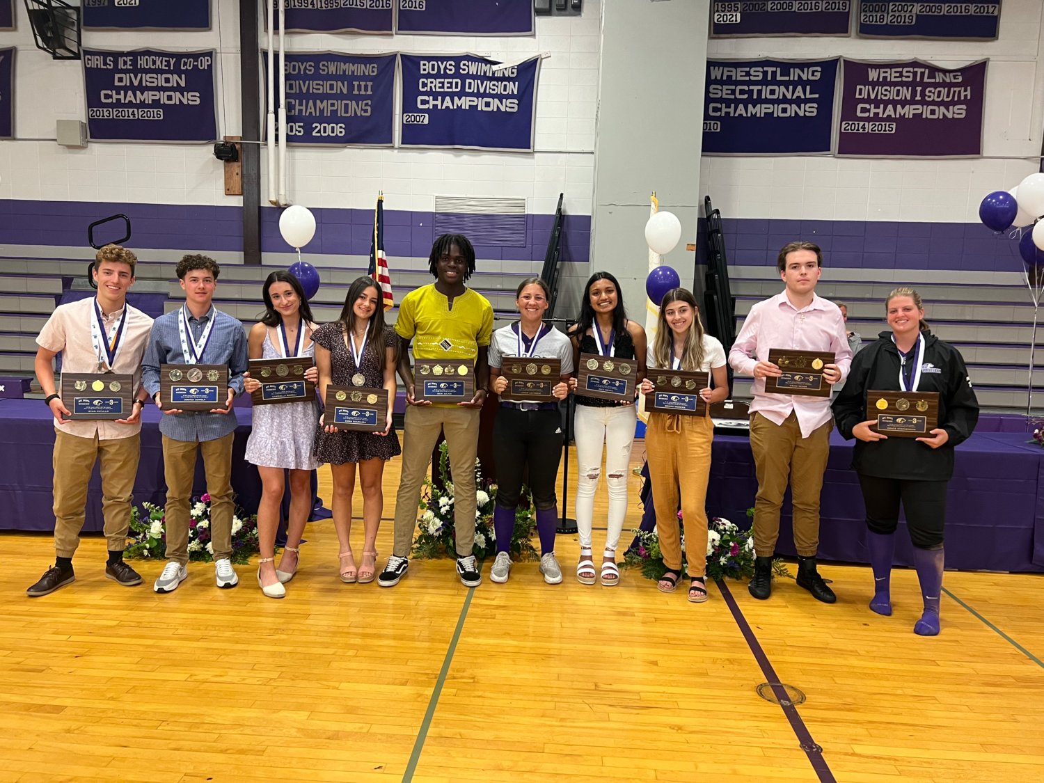 Joshua deWolf, Cross-Country, Basketball, Lacrosse; Gabriella Marsili, Cross-Country, Indoor Track, Outdoor Track; Emma Bourassa, Soccer, Indoor Track, Lacrosse Rick Julien, Football, Basketball, Track, Volleyball; Logan Levesque, Soccer, Basketball, Softball; Aditi Mehta, Tennis, Basketball, Outdoor Track; Briana Moreira, Cross-Country, Indoor Track, Outdoor Track; Ryan Patullo, Swim, Unified Basketball, Volleyball; and Craig Vedar, Football, Wrestling, Lacrosse Grace Stephenson Volleyball, Basketball, Softball, received the 3-Sport Athlete Awards.
