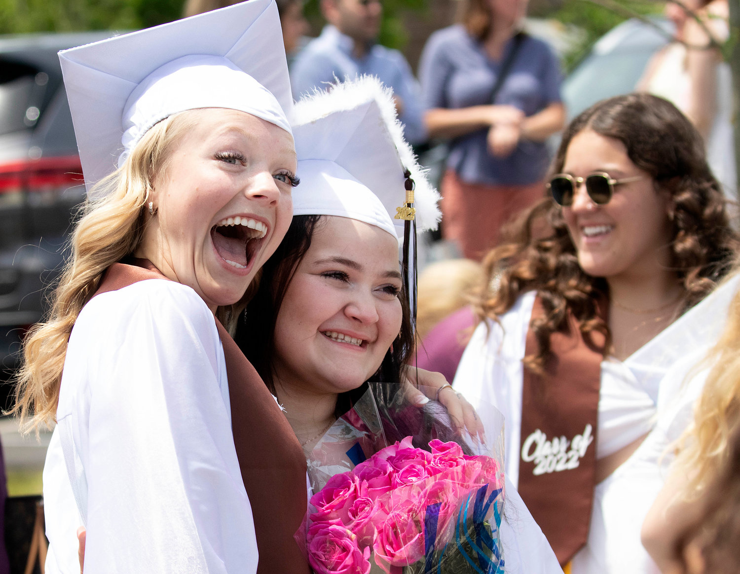 Samantha McCarthy (left) and friend Madison Mazzarella take a photo together after graduation. 
