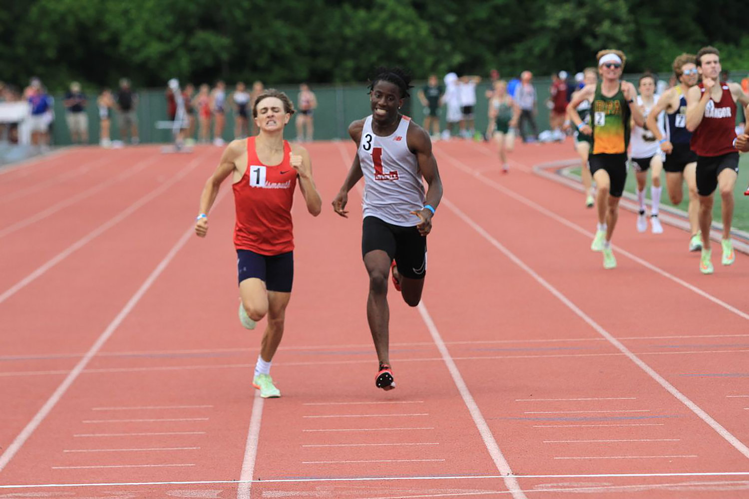 The Patriots’ Kaden Kluth (left) became the first-ever boys’ New England champion from Portsmouth High School when he won the 800-meter race in a time of 1:52.45 during the New England Interscholastic Outdoor Track and Field Championship held June 11 in New Britain, Conn. At right is the second-place finisher, David Vandi of Lowell, Mass.