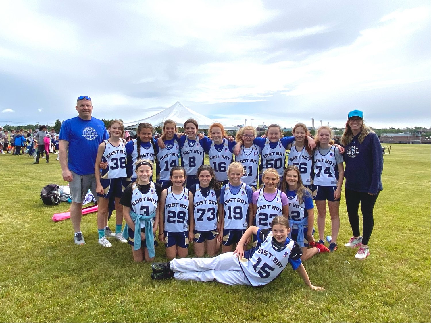 Members of the East Bay Lacrosse Grades 5/6 Division team pose for a photograph after winning the state championship. Pictured are (from left to right, back row) Brad Wilson, Eleanor Lial, Maria Lamb, Charlotte Farrell, Clare Capozza, Ella Martin, Adelaide Crosby, Stella Tisdale, Grace Wilson, Reese Mancini and Cerissa Blaney, (front row) Kendall Blaney, Molly Reagan, Keira Martin, Nina Hansen, Daisy Moscrop and Tessa Lapinski, and (laying in front) Avery Fisher. Not pictured is Julia Alessandro.