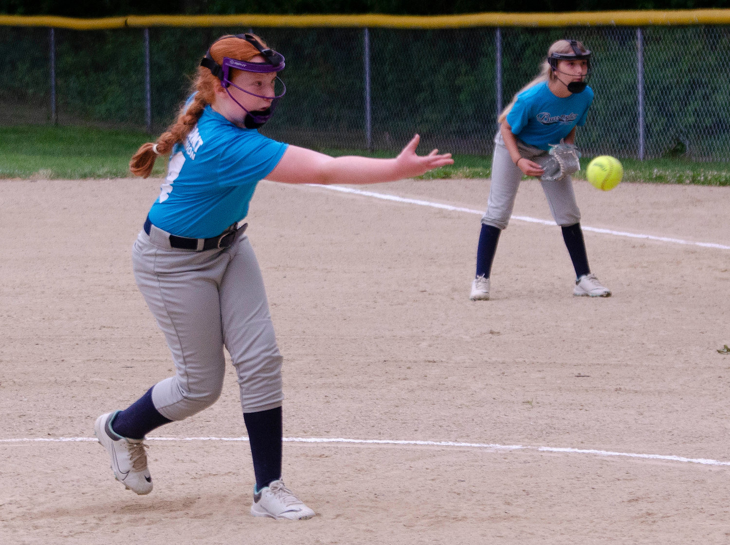 Navigant pitcher Claire Bickford throws a strike during the Barrington Little League softball minors division championship game at Haines Park recently.