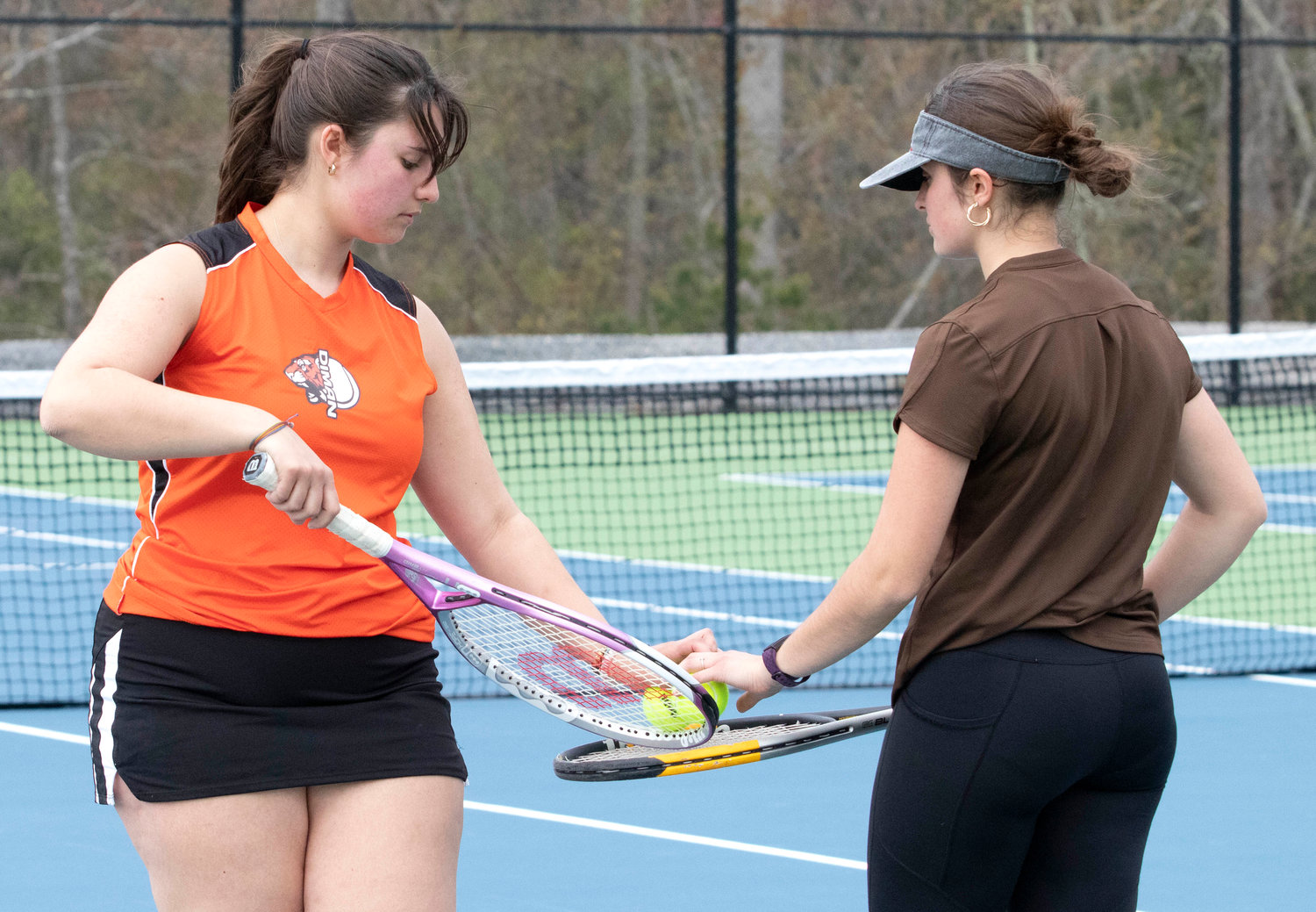 Sarah (left) and younger sister, Gloria both second singles players, squared off during the Diman vs Westport match. The young sister prevailed in straight sets.