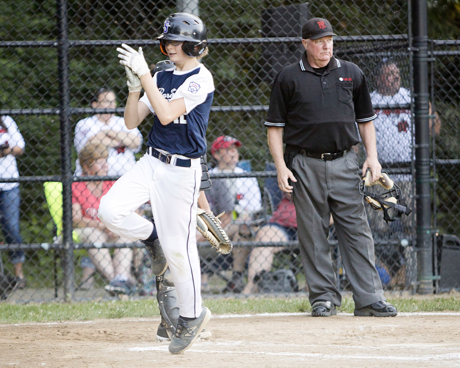 Finn Loverme claps after scoring a run in the last inning of the 12U All-Stars playoffs, against East Providence, Saturday.