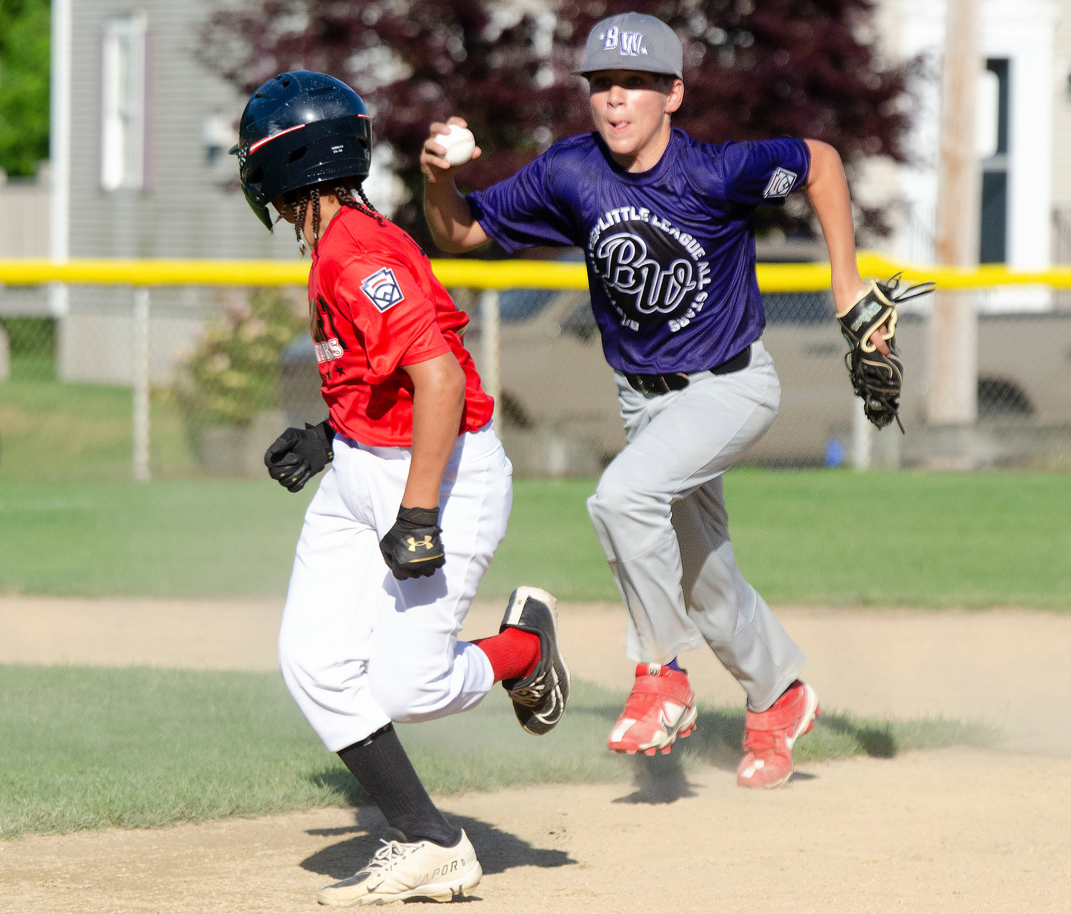 Shortstop Michael Towers chases down a Newport base runner after he was caught in a pickle. 