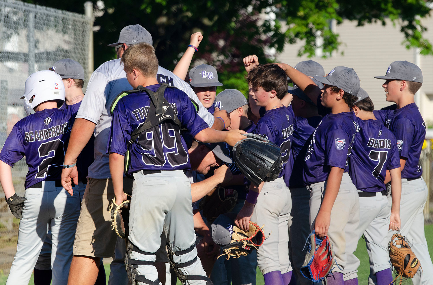Coach Steve Furtado rallies the team between innings during their 5-0 victory over Newport on Saturday. 