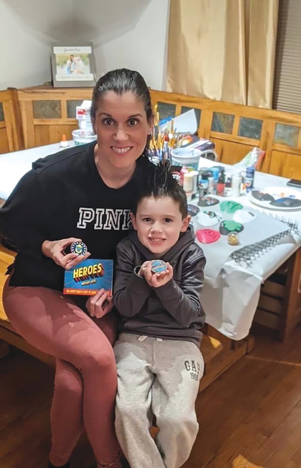 Sheri Scetta Arbige, shown with her son, Jaxon, was inspired to start the Aquidneck Shells effort back in 2020. It has grown exponentially since then.