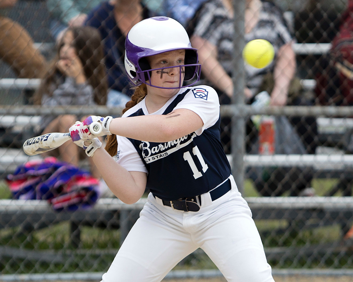 Claire Bickford keeps her eye on the ball while at bat against Middletown, Tuesday.