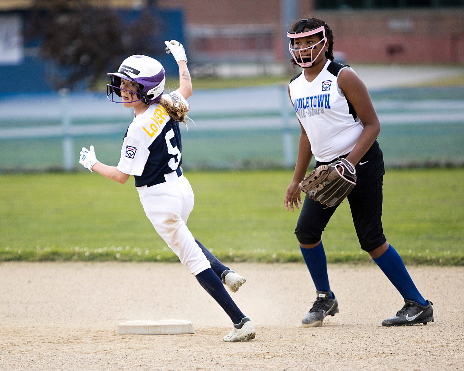 Emma Loverme watches for the ball as she rounds second base.
