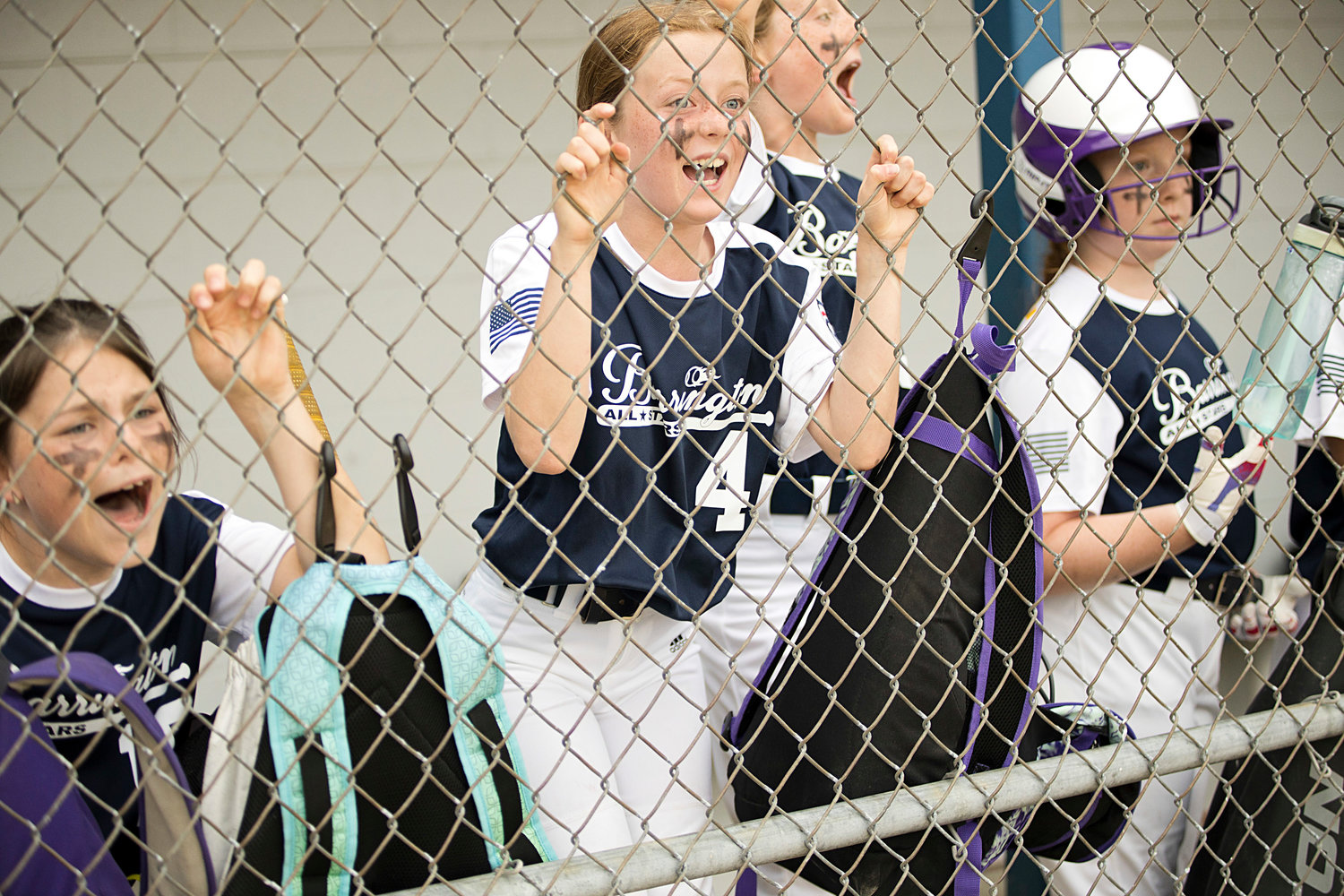 Players cheer from the dugout during Tuesday's playoff game, against Middletown.