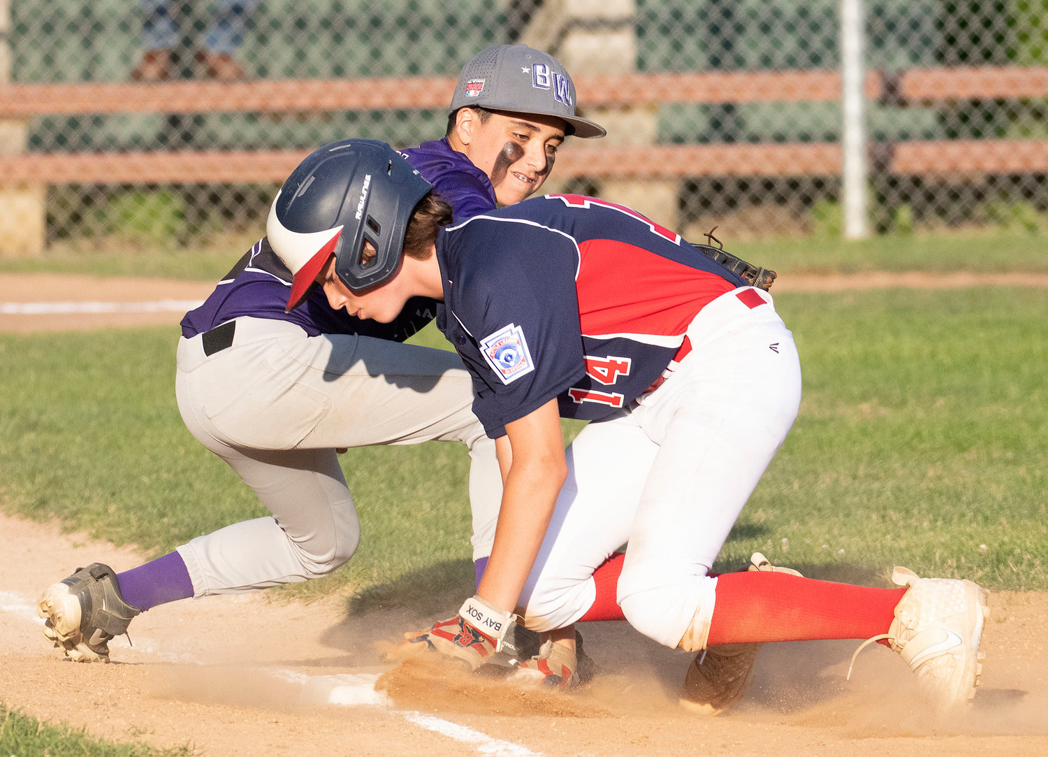 Kevin Casey puts the tag on Ben Humm during a pick off attempt. Humm was safe on the play.