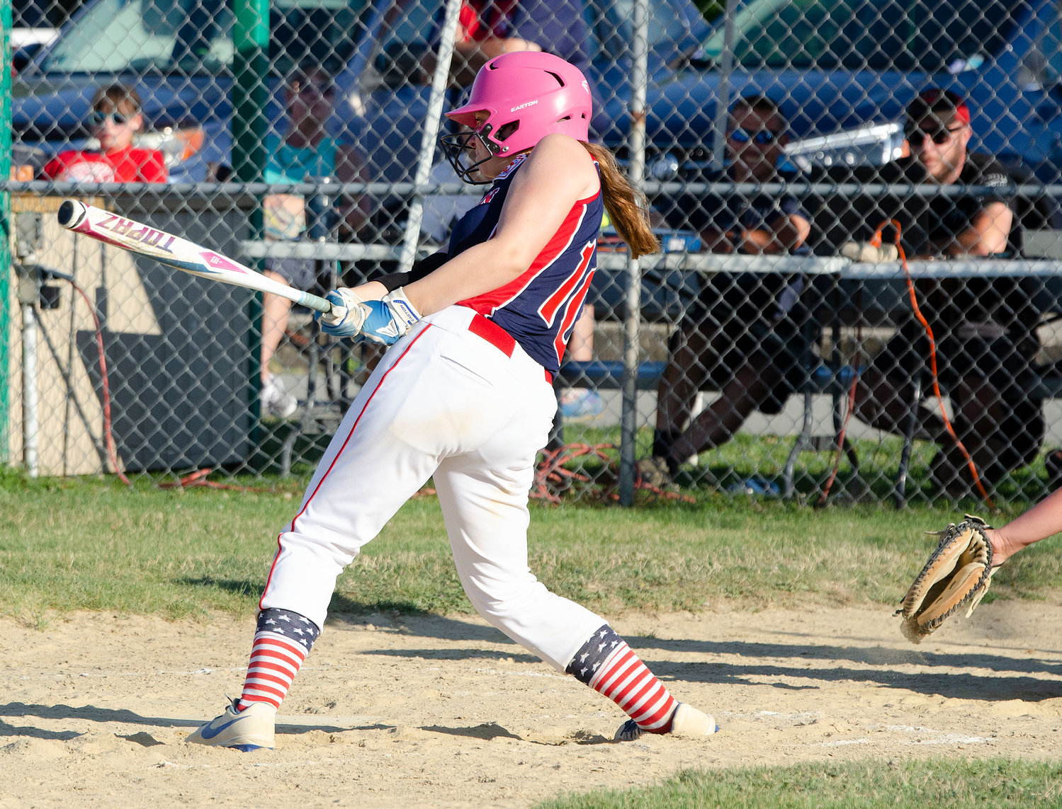 Carlie Martin belts a bases clearing line drive triple to right field in the second inning.