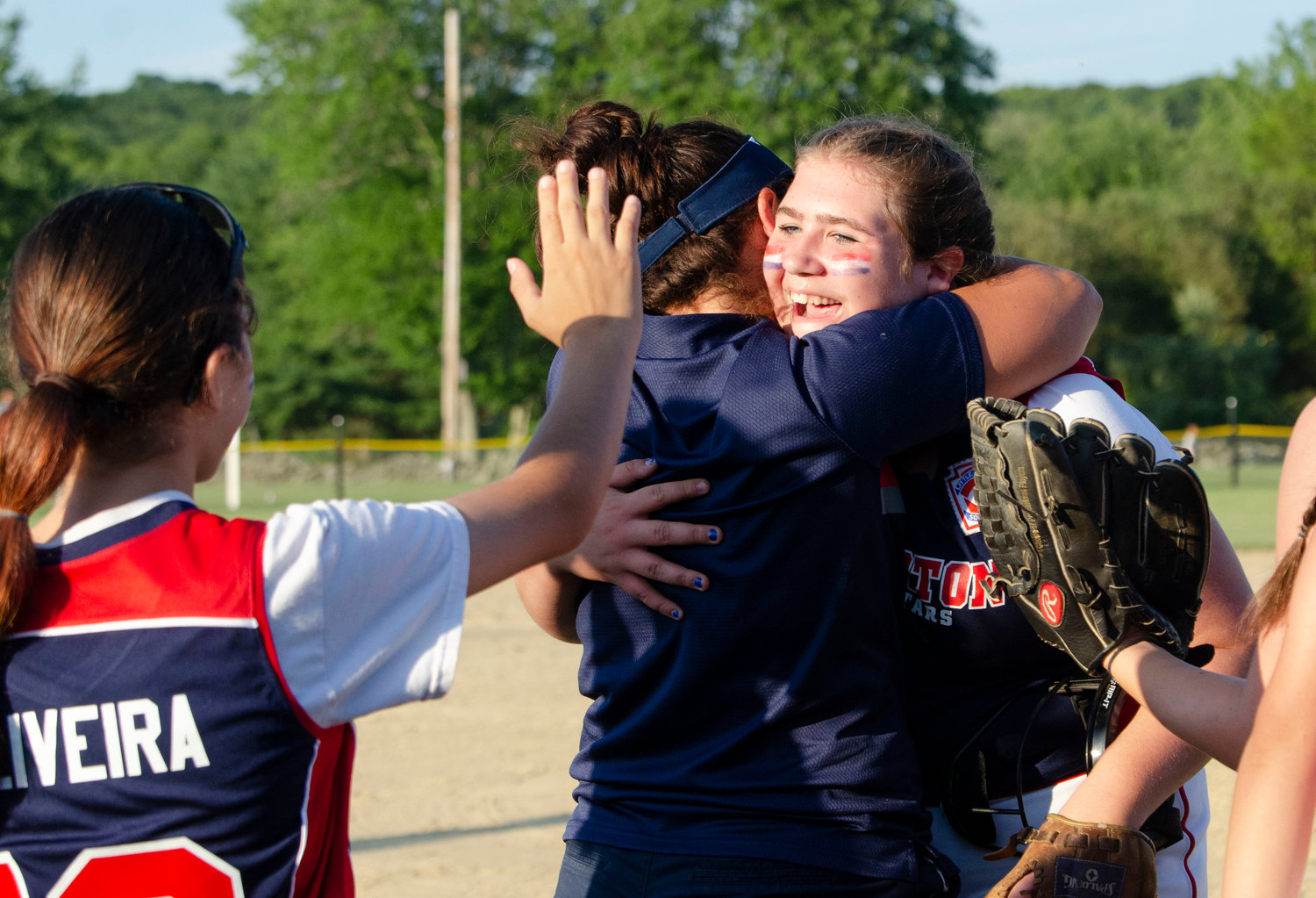Addie Wolf gets a big hug from assistant coach Jess Silvia after the win.