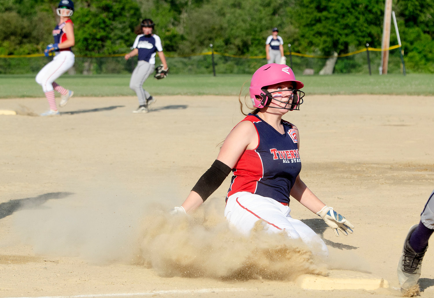 Carlie Martin slides safely into third base during the game.