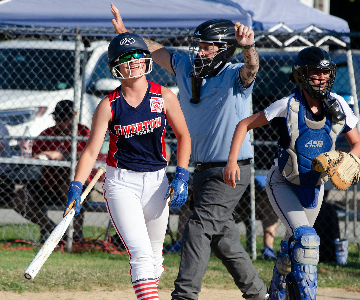 Cleanup hitter Elodie Cannon smiles after getting hit by a pitch during an at bat in game two.
