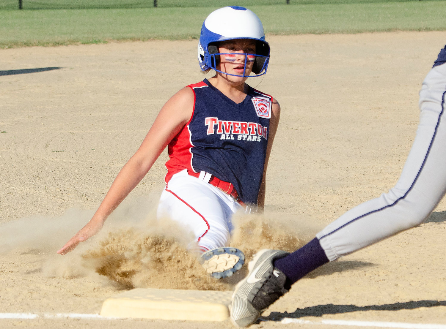 Brooke Sowa slides into third base safely in the first inning against South Kingstown.