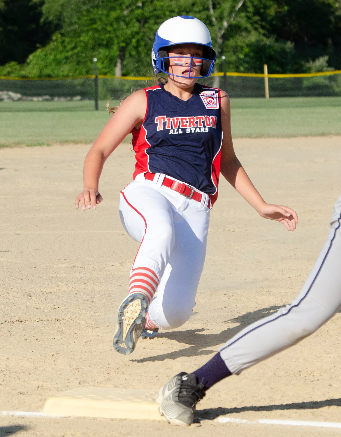 Leadoff hitter Brooke Sowa steals third base in the first inning during the team's game against South Kingstown during the 11-12 softball state championship series at Town Farm Field on Wednesday.