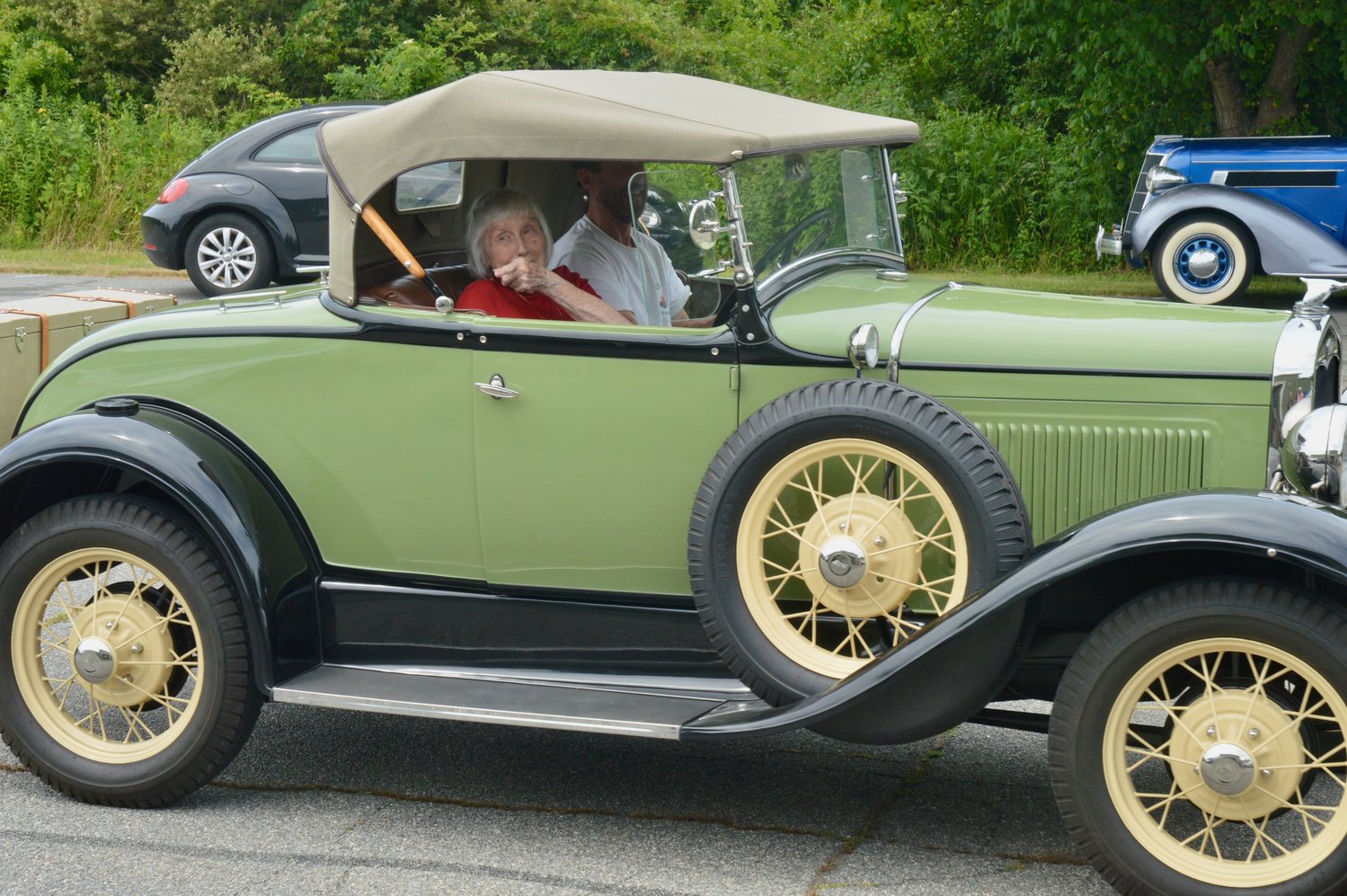 Mary Martin arrives to the surprise party in a 1931 Model A Ford, driven and owned by Bob Lantz.