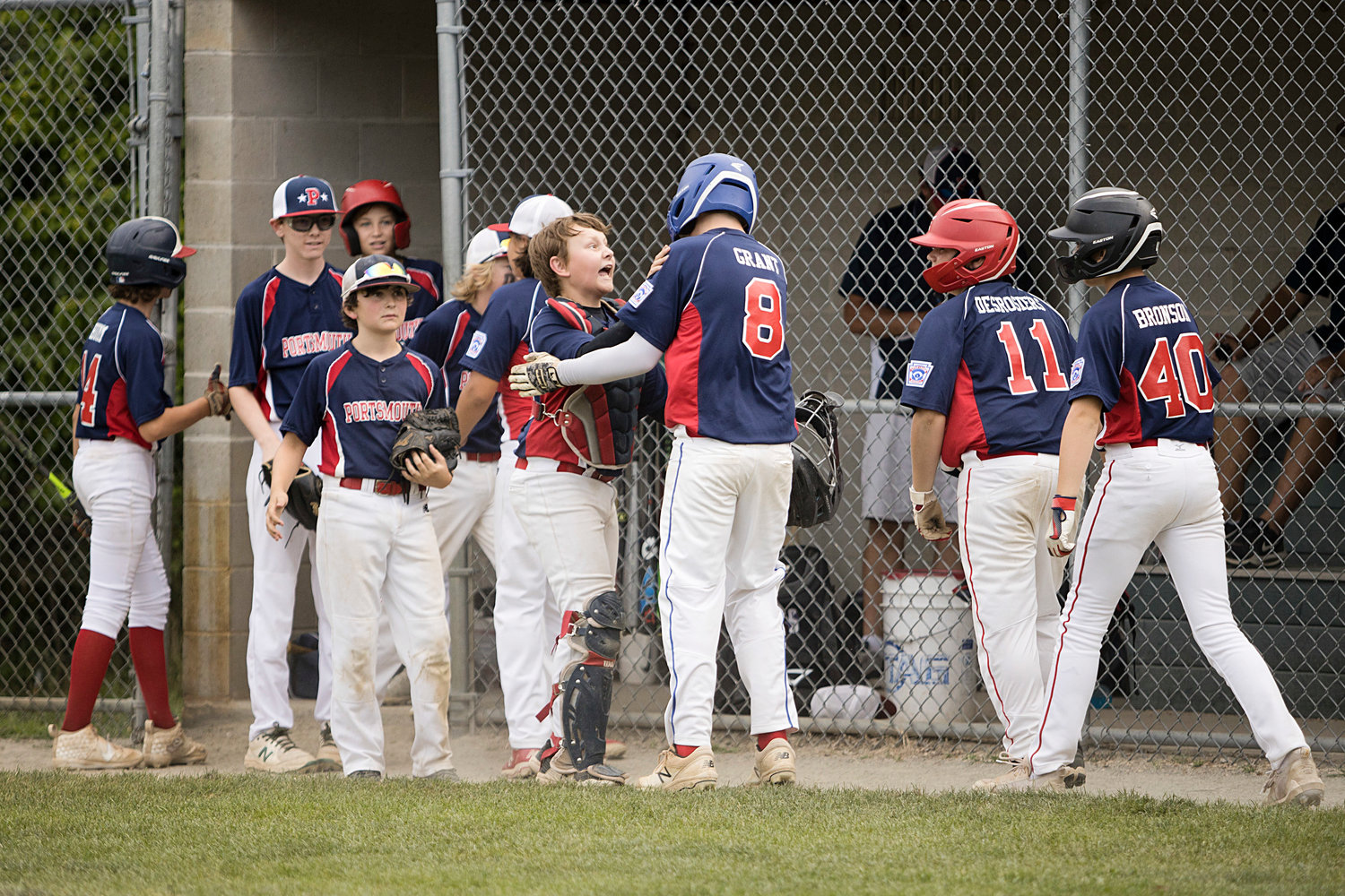 Portsmouth All-Stars celebrate after a successful inning against Bristol/Warren.