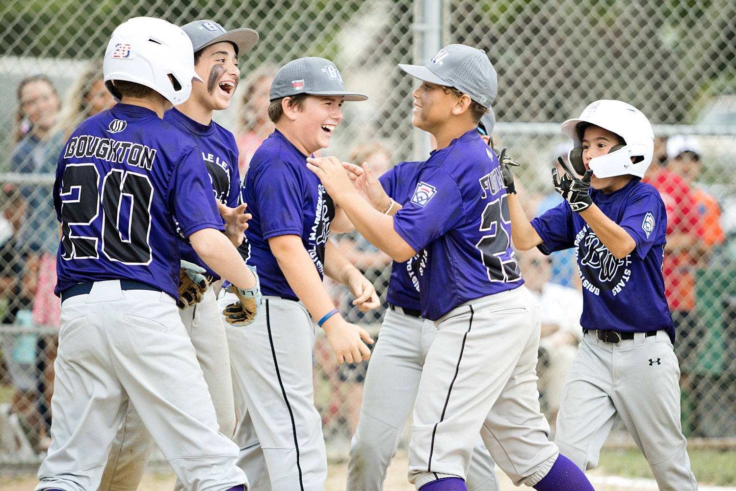 The Bristol Warren All-Stars celebrate a homerun hit by Blake Boughton in the sixth inning of the District 2 finals, Saturday.