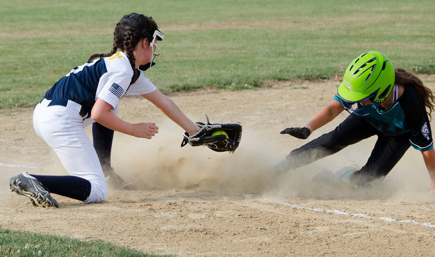 Sarah Clegg tries to put the tag on a Cranston Western runner at third base.