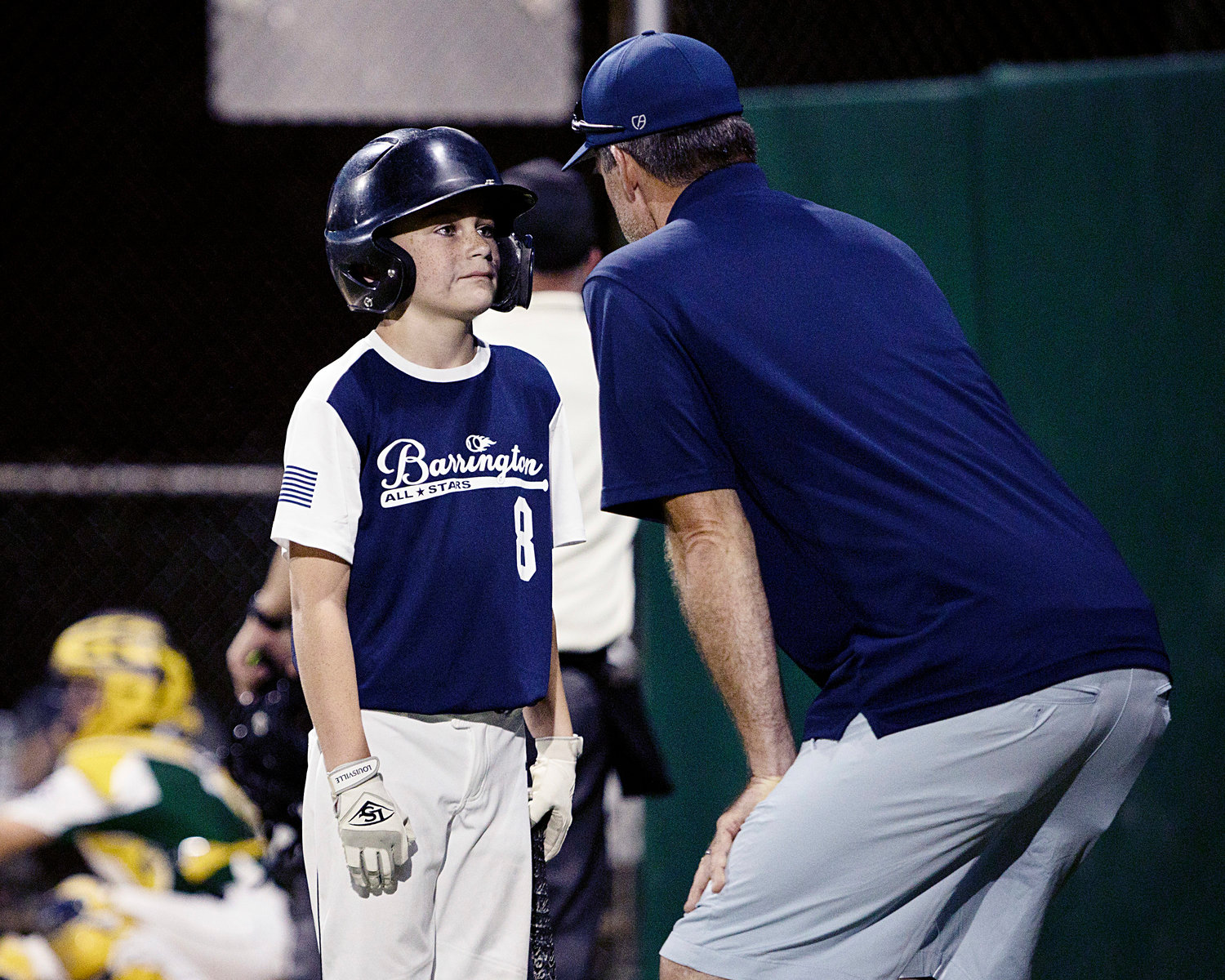 Luke Hanley is offered advice on his way up to bat against Cranston East in the 11U All-Star State Tournament, Wednesday.