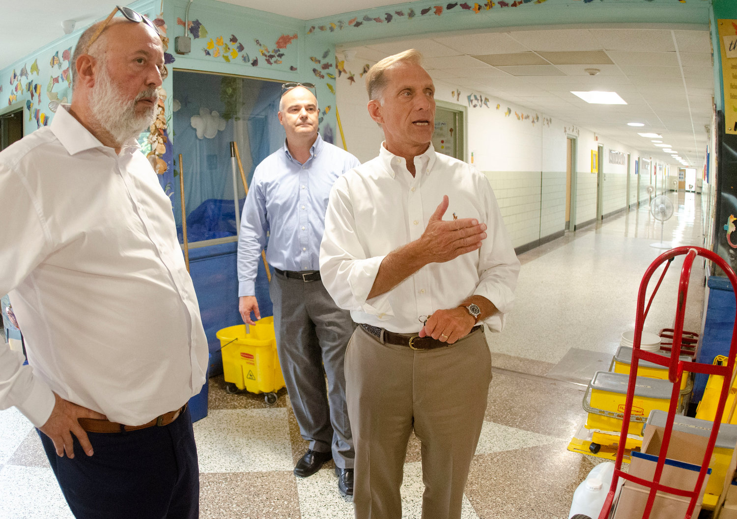 Barrington Superintendent of Schools Michael Messore (right) and finance director Doug Fiore (center) lead a tour for Joseph DaSilva, the coordinator for the state’s school building authority (left).
