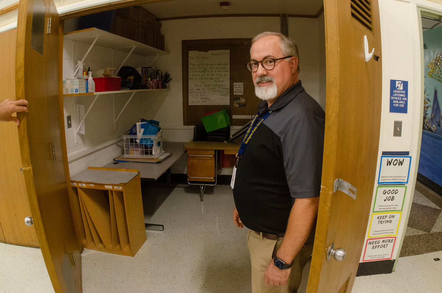Matt Glum, the director of facilities for Barrington schools, stands near one of the storage closets that have been converted into teachers’ offices at Nayatt.
