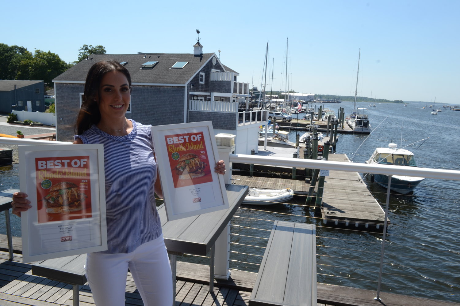 Marissa Ferris stands among the top deck of The Wharf, which she acquired with her husband four years ago. The stunning vista earned her the accolade of Best Outdoor Dining spot in the East Bay, and their improvements to the restaurant earned them the Best Restaurant in the East Bay award among much competition.