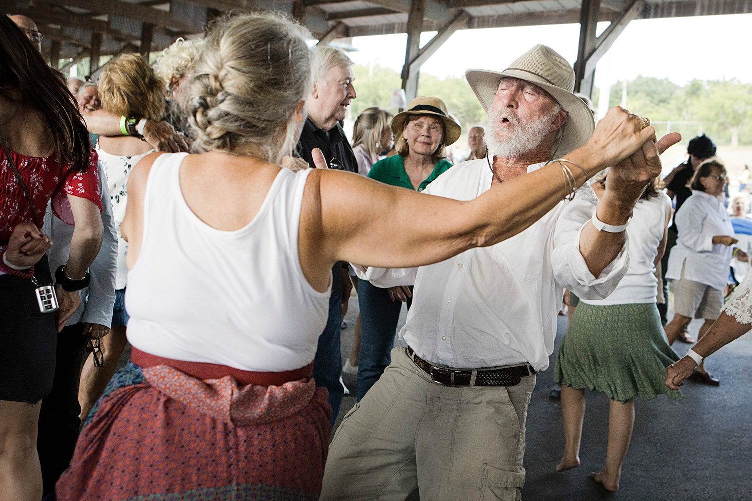 Wally Zembo and a friend dance the afternoon away as The Funky White Honkies lay down a groove at Saturday's Shellstock fund-raiser at the Westport Fairgrounds.