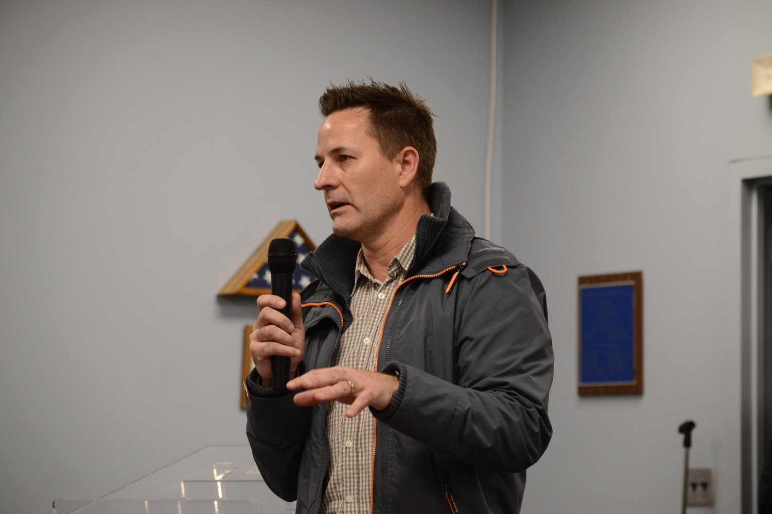 Andrew Naperotic, Principal and co-founder of Addaspace, addresses a full crowd at Warren Town Hall during a public meeting back in March, where dozens of residents spoke out against the initial design concept of the project.